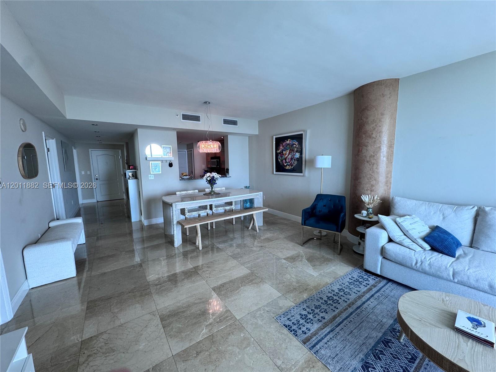 2101 Brickell Avenue, Unit 3205 Miami, FL 33129 - Photo 9 of 31 a living room with furniture and a rug