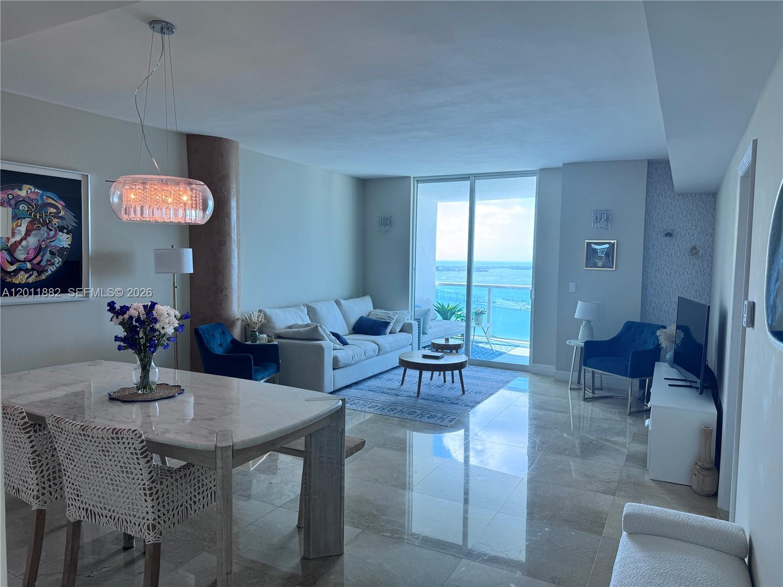 2101 Brickell Avenue, Unit 3205 Miami, FL 33129 - Photo 10 of 31 a view of a dining room with furniture window and outside view