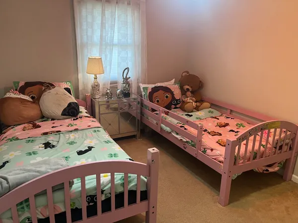 a bedroom with a bed and a dresser