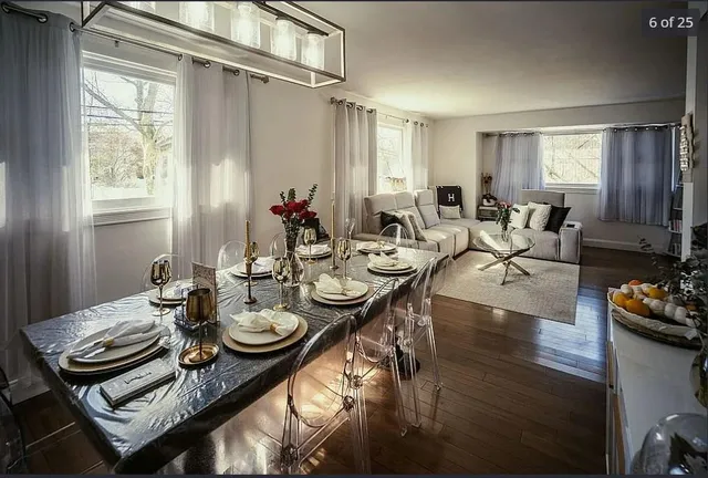 a view of a dining room with furniture window and wooden floor
