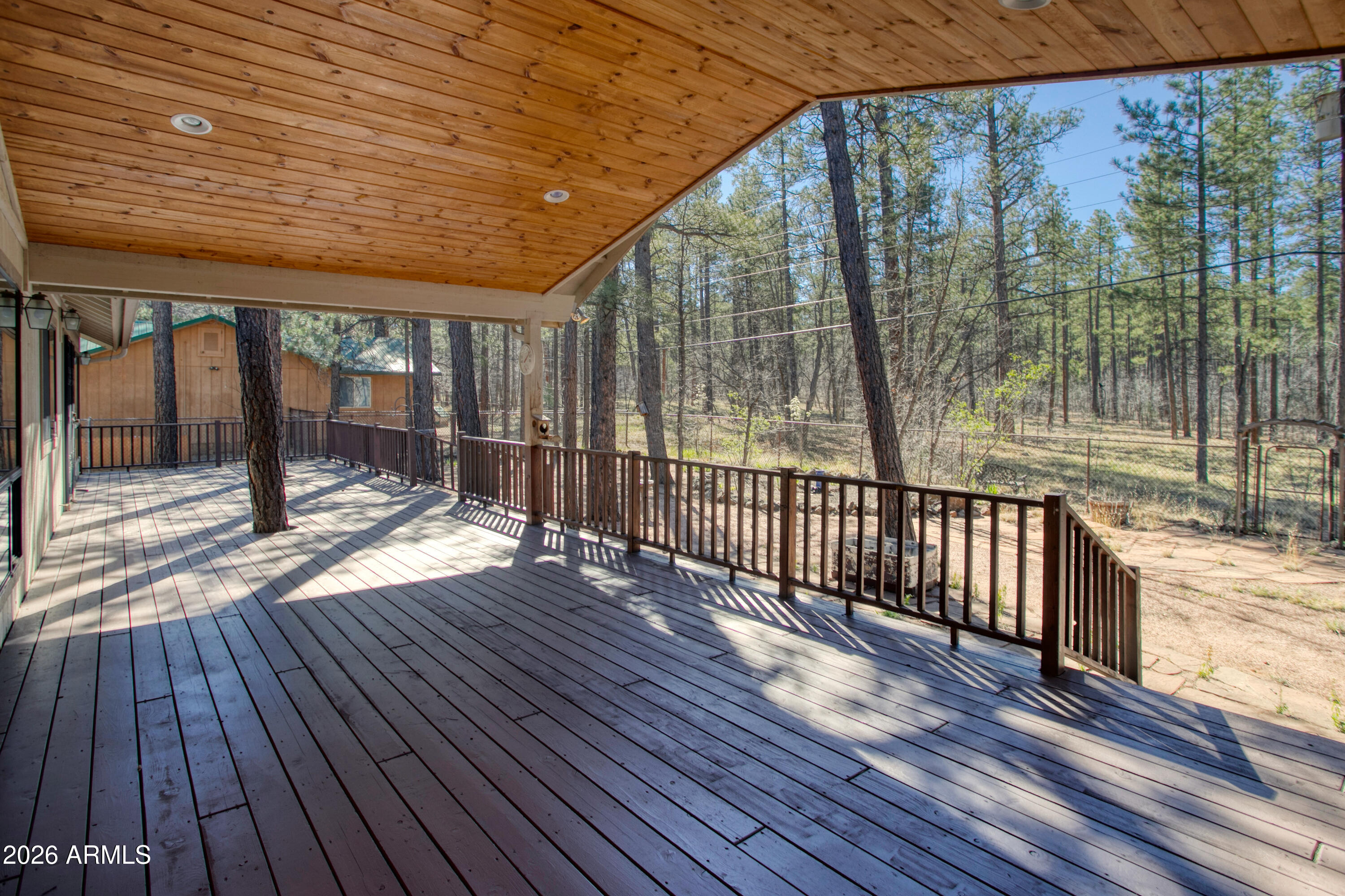71 East Turkey Track Lane Pinetop, AZ 85935 - Photo 25 of 50 a view of a porch with wooden floor