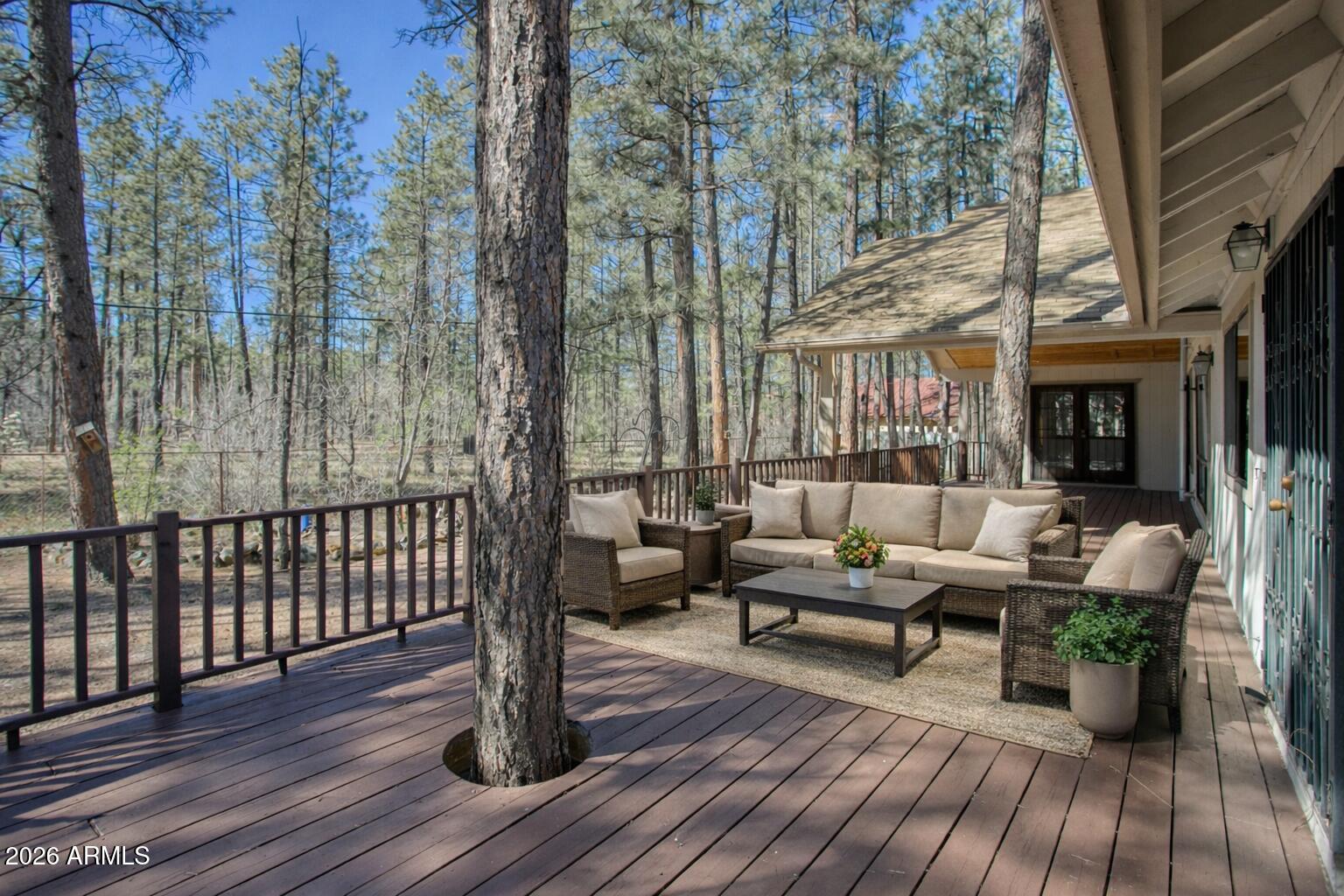 71 East Turkey Track Lane Pinetop, AZ 85935 - Photo 26 of 50 a patio with patio a couch and wooden floor