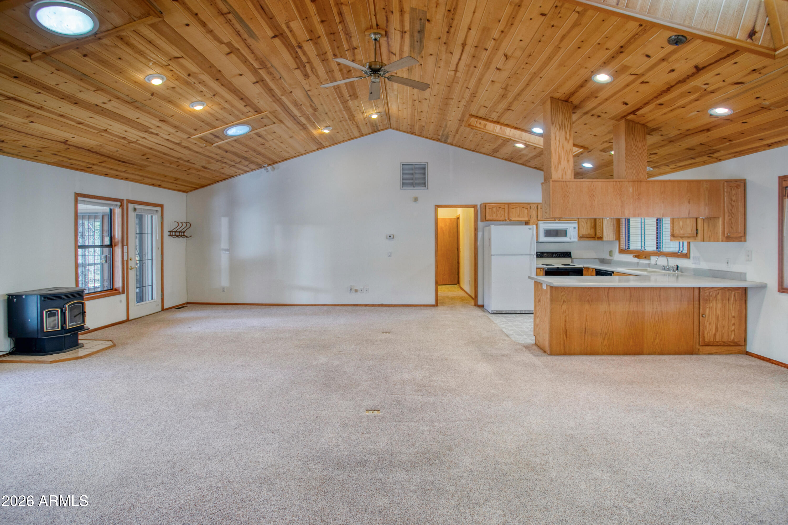 71 East Turkey Track Lane Pinetop, AZ 85935 - Photo 5 of 50 a view of a kitchen with a sink and cabinets