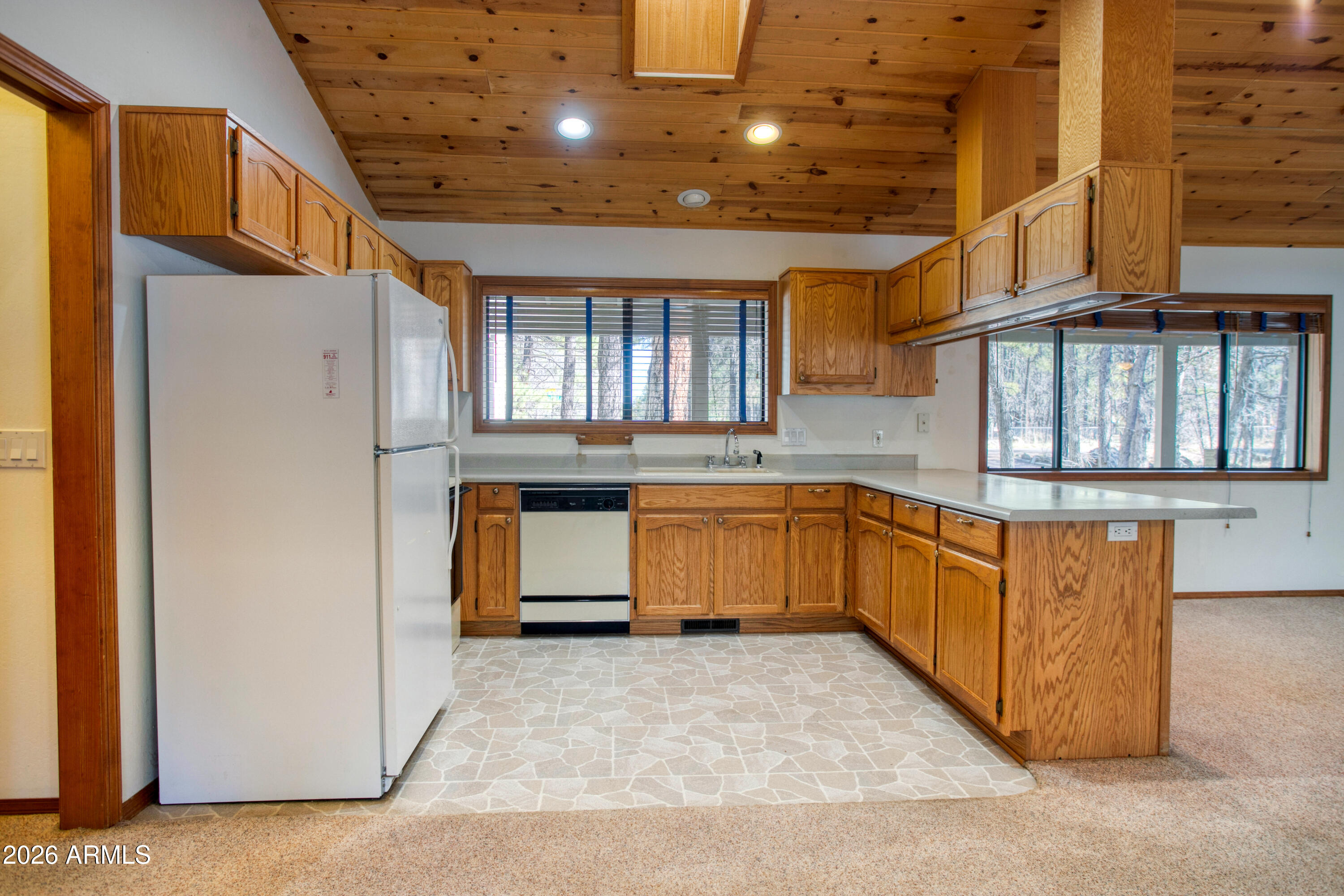 71 East Turkey Track Lane Pinetop, AZ 85935 - Photo 7 of 50 a kitchen with stainless steel appliances granite countertop a stove a refrigerator and a sink