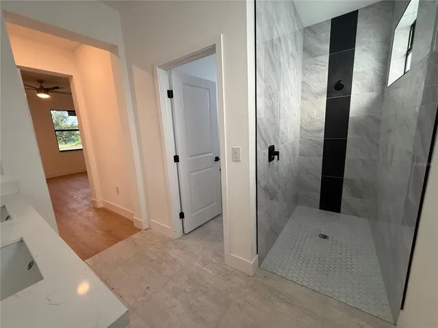 a view of an empty room with a window