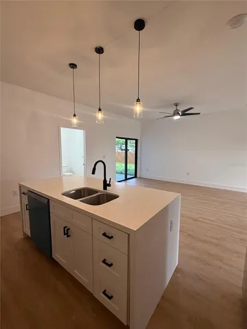 a kitchen with a sink and cabinets