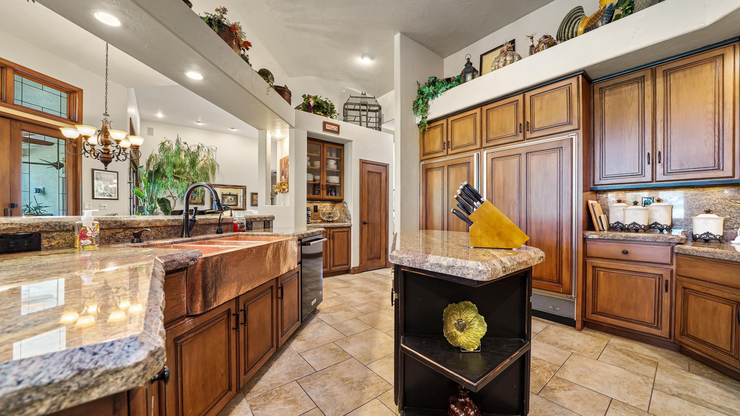 815 25 Road Grand Junction, CO 81505 - Photo 13 of 42 a kitchen with stainless steel appliances granite countertop a sink a stove and a refrigerator