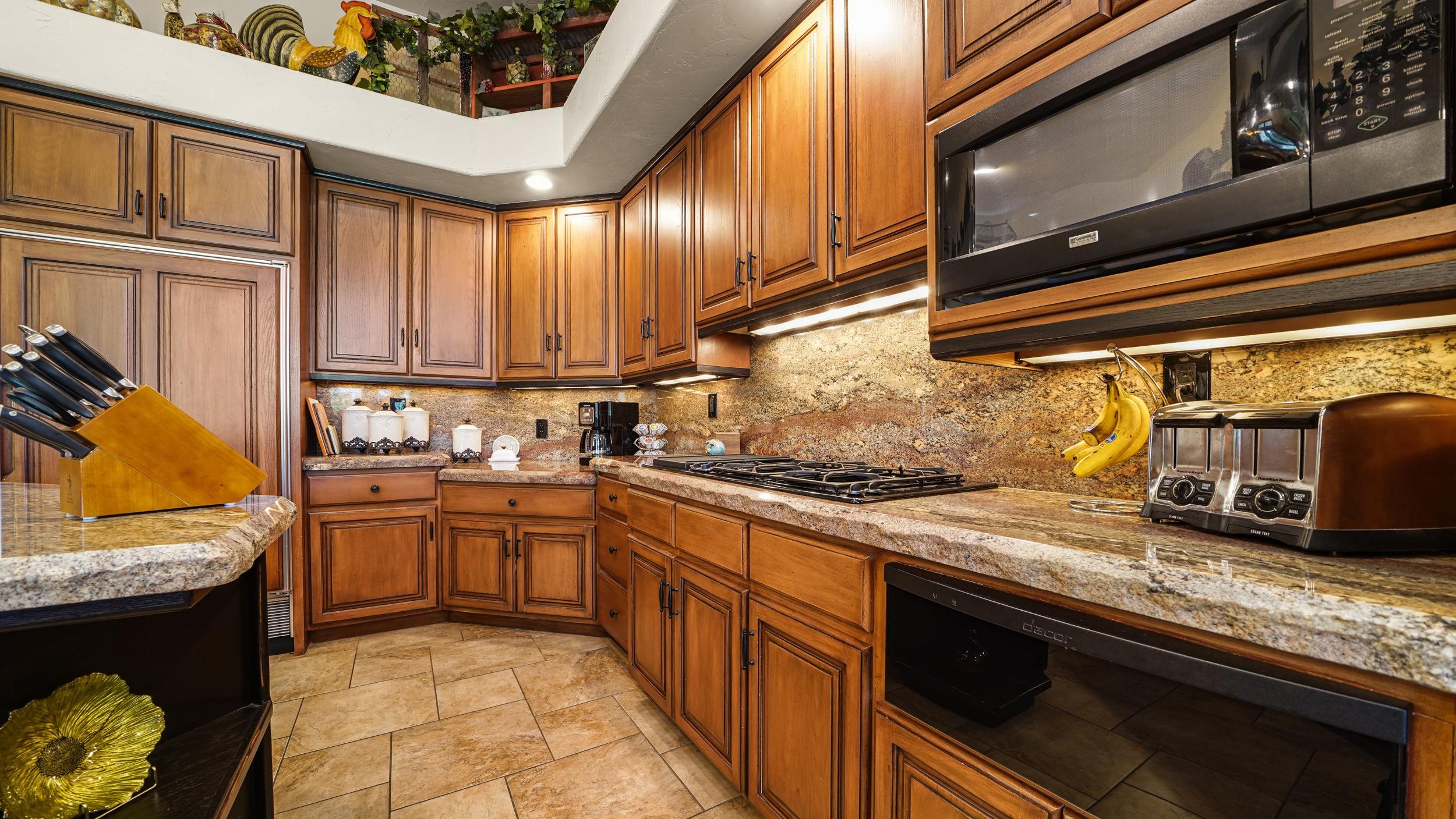 815 25 Road Grand Junction, CO 81505 - Photo 14 of 42 a kitchen with stainless steel appliances granite countertop a sink and a stove