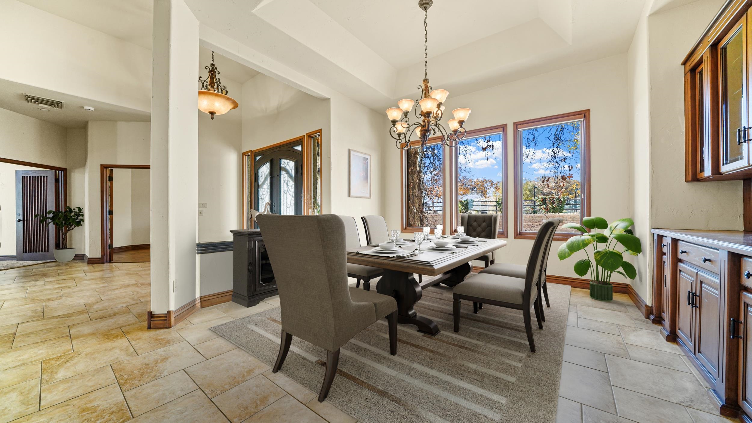 815 25 Road Grand Junction, CO 81505 - Photo 17 of 42 a view of a dining room with furniture window and chandelier