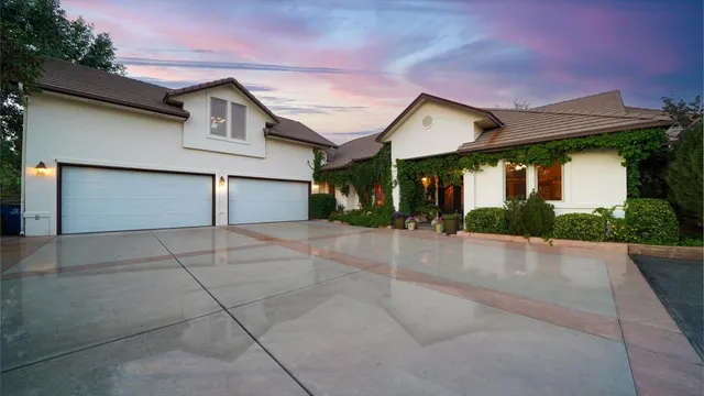an aerial view of multiple houses with a yard