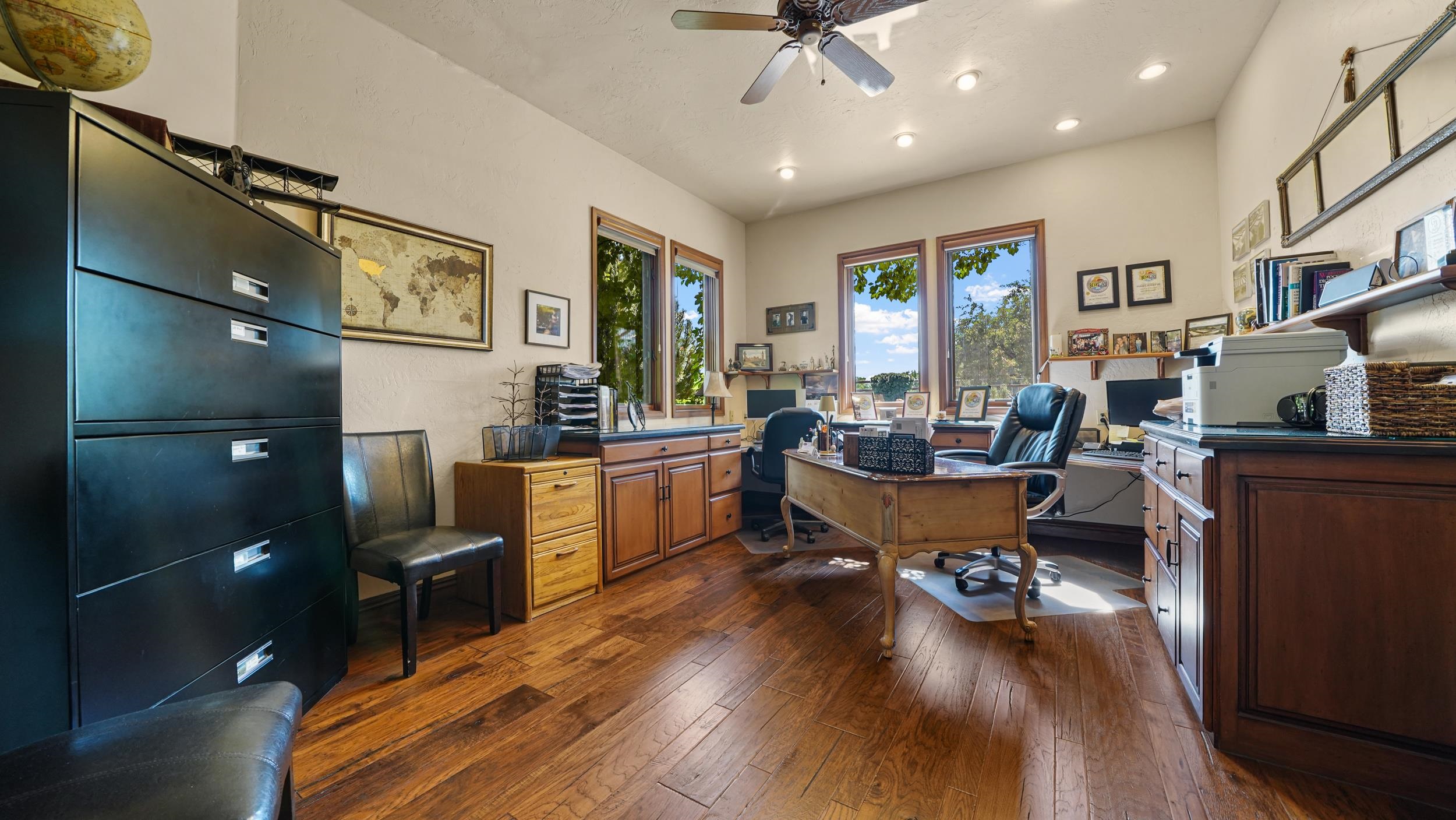 815 25 Road Grand Junction, CO 81505 - Photo 27 of 42 a living room with furniture and a wooden floor