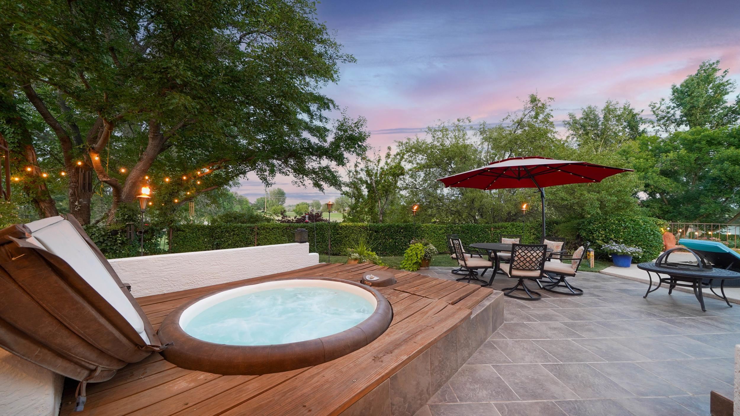 815 25 Road Grand Junction, CO 81505 - Photo 38 of 42 an outdoor sitting area with furniture and umbrella