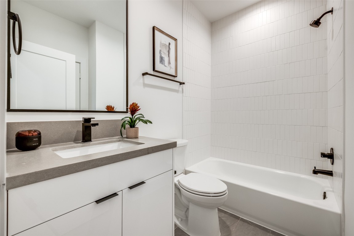 2630 Peckham Street Houston, TX 77098 - Photo 49 of 50 a bathroom with a sink a toilet and bathtub