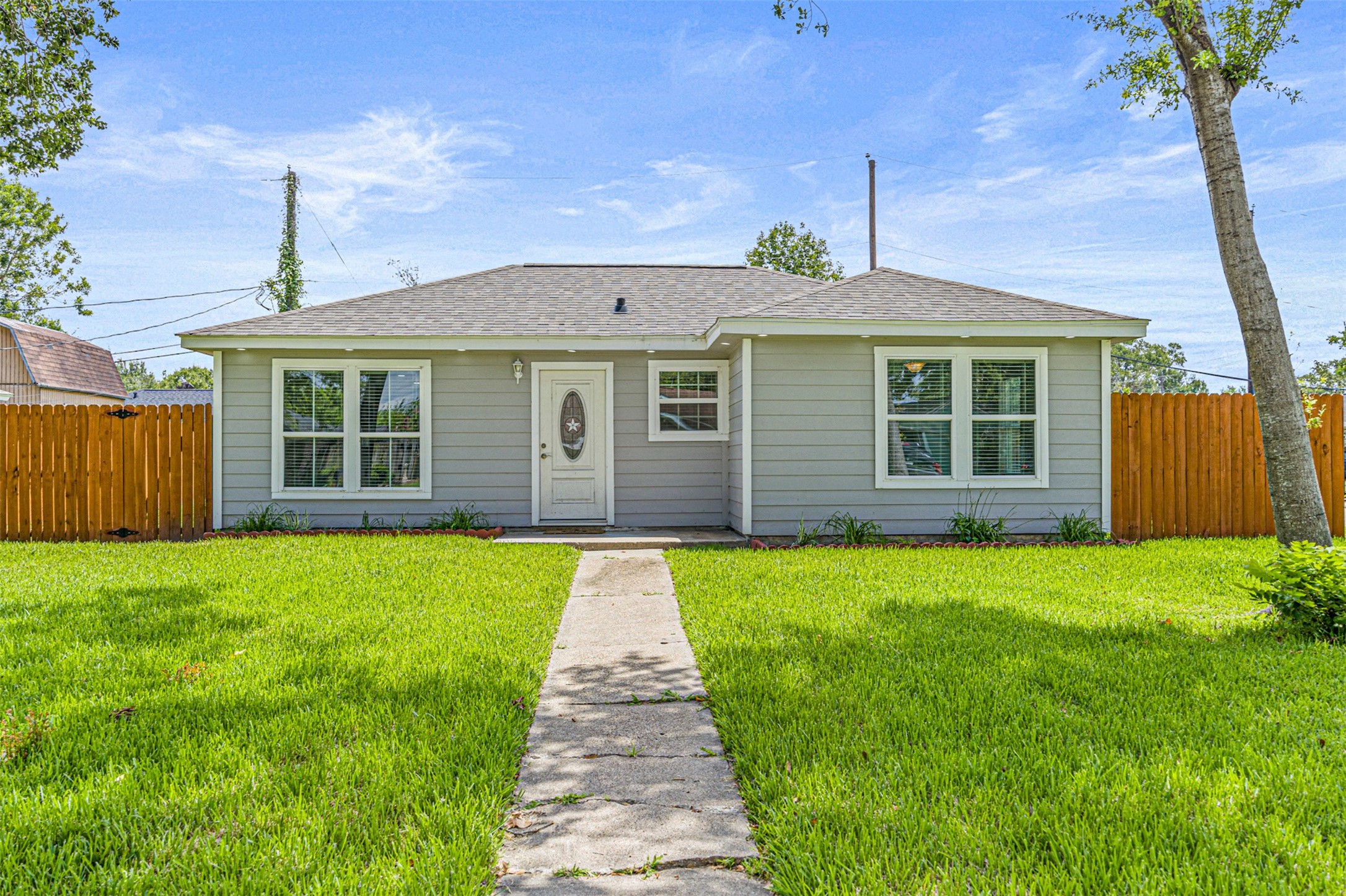 702 Norell Street Channelview, TX 77530 - Photo 1 of 16 a front view of a house with a yard