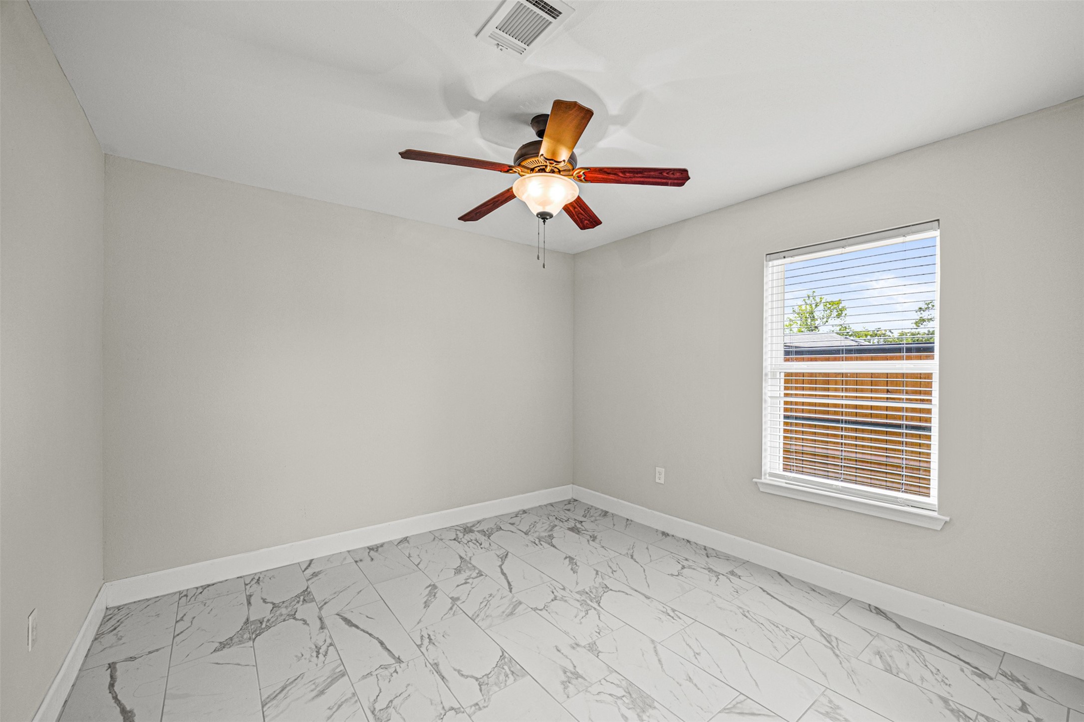 702 Norell Street Channelview, TX 77530 - Photo 12 of 16 a view of empty room with ceiling fan
