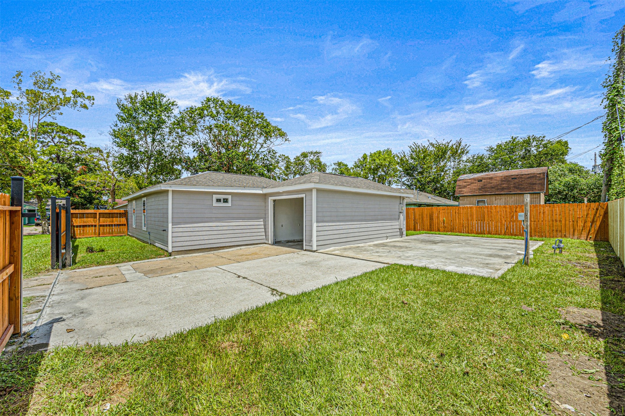 702 Norell Street Channelview, TX 77530 - Photo 15 of 16 a front view of a house with a yard and garage