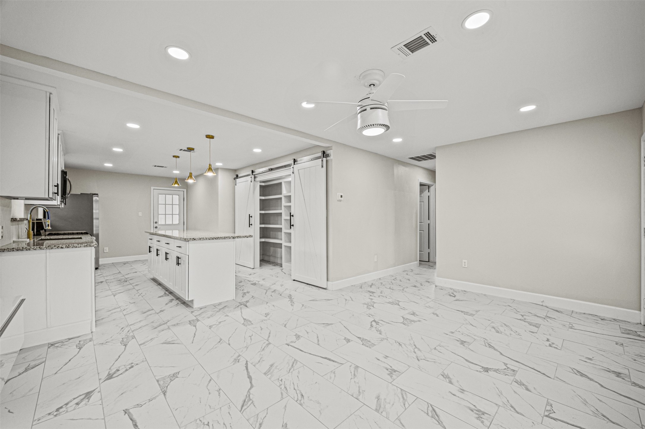 702 Norell Street Channelview, TX 77530 - Photo 3 of 16 a view of kitchen with refrigerator and white cabinets