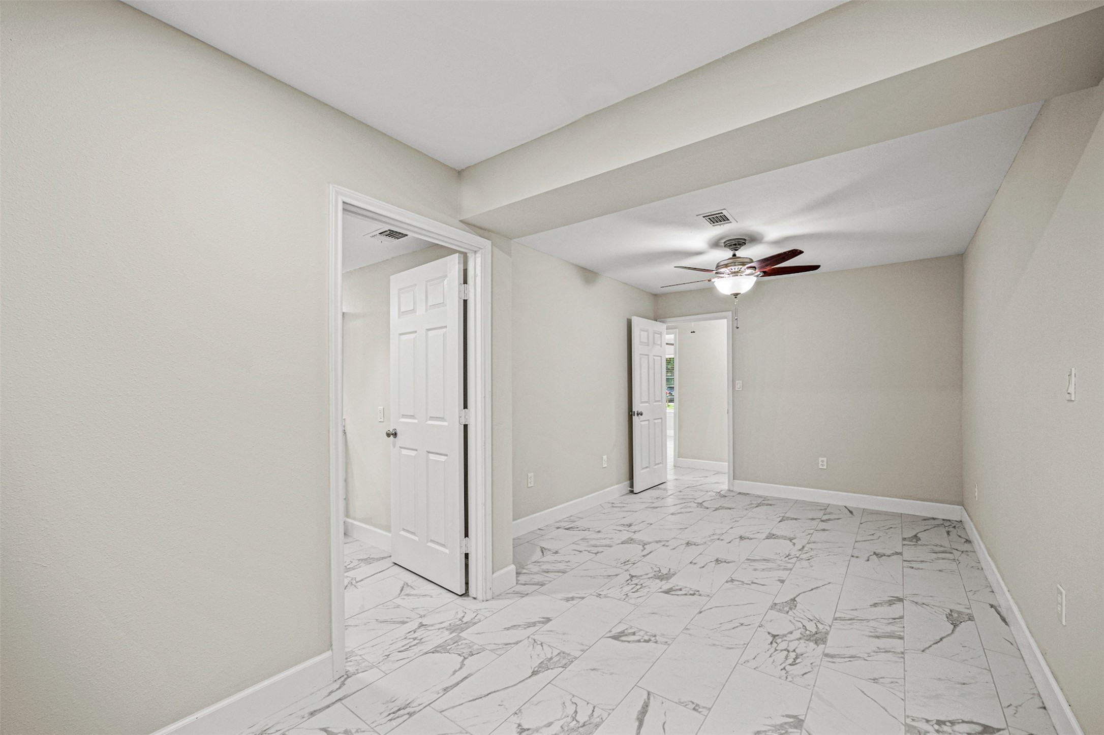 702 Norell Street Channelview, TX 77530 - Photo 8 of 16 a view of a bathroom with a shower and a chandelier