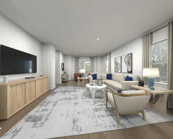 a living room with furniture a flat screen tv and a window