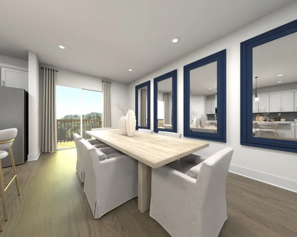 a dining hall with stainless steel appliances granite countertop a stove and a refrigerator