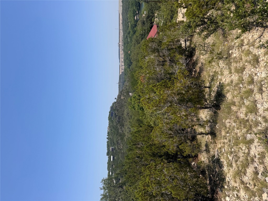 2506 Geronimo Trail Austin, TX 78734 - Photo 4 of 22 a view of a city with lush green forest