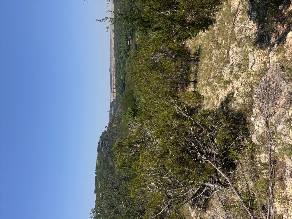 2506 Geronimo Trail Austin, TX 78734 - Photo 8 of 22 a view of a large mountain with mountains in the background