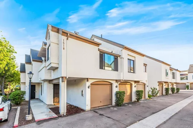 a front view of a house with a garage