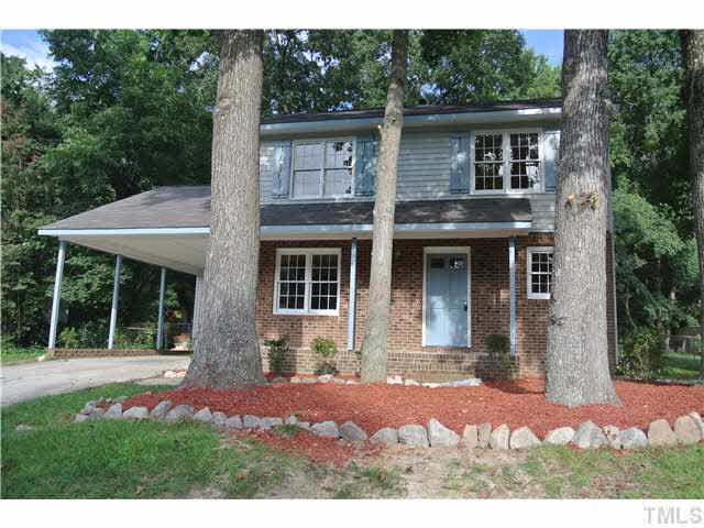 3908 Summer Place Raleigh, NC 27604 - Photo 1 of 15 a front view of a house with a yard