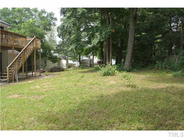3908 Summer Place Raleigh, NC 27604 - Photo 14 of 15 a view of outdoor space with deck and green space