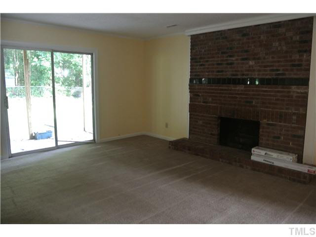 3908 Summer Place Raleigh, NC 27604 - Photo 5 of 15 a living room with a fireplace