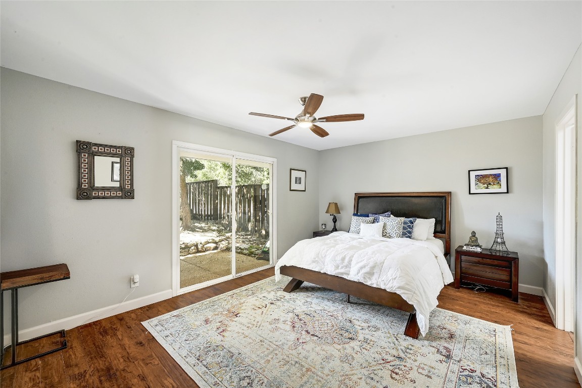 409 Seawind Lakeway, TX 78734 - Photo 15 of 18 a bedroom with a large bed and a window