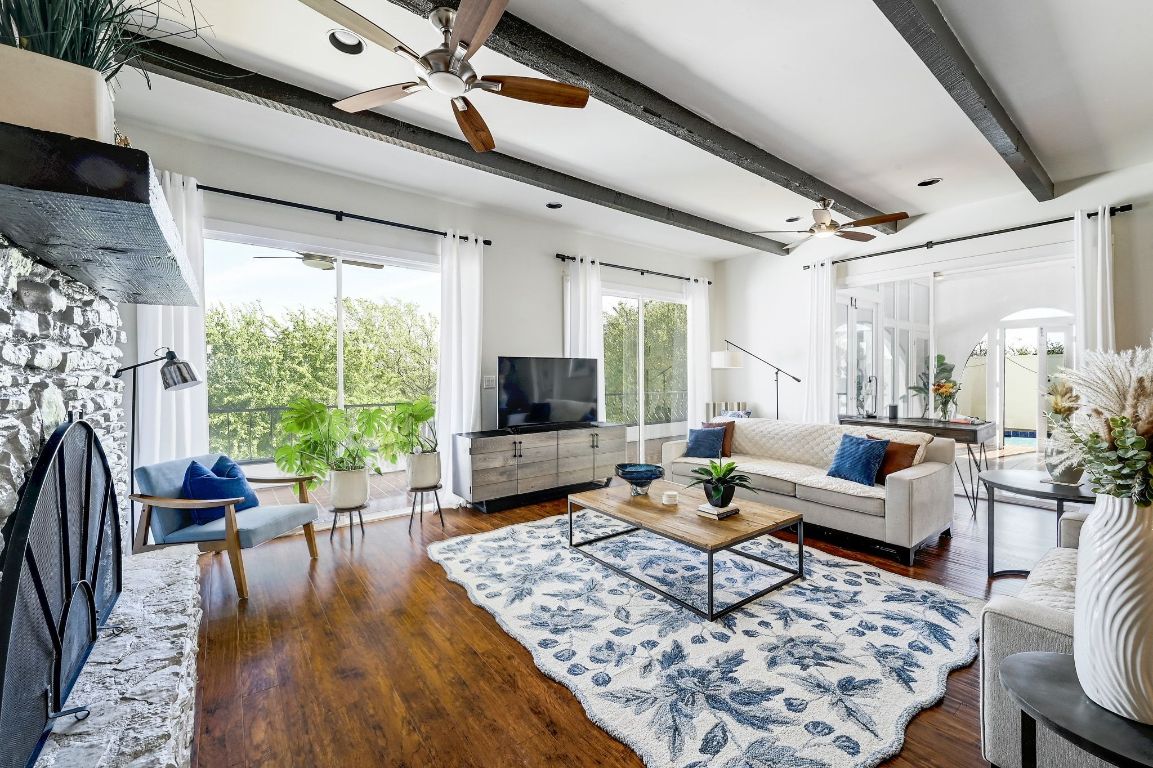 409 Seawind Lakeway, TX 78734 - Photo 4 of 18 a living room with furniture tv and a large window