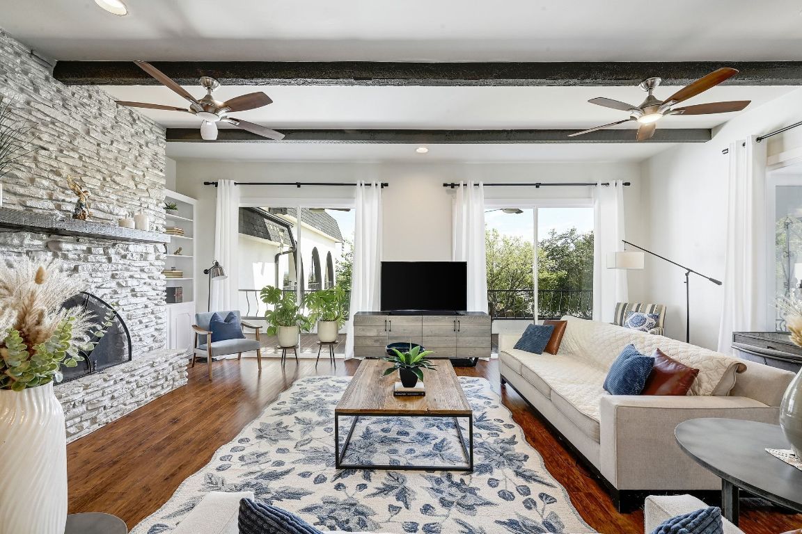 409 Seawind Lakeway, TX 78734 - Photo 5 of 18 a living room with furniture and a flat screen tv