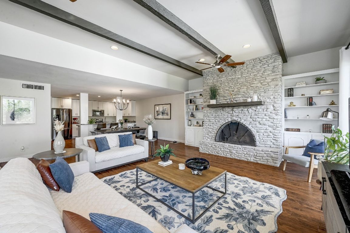 409 Seawind Lakeway, TX 78734 - Photo 6 of 18 a living room with furniture and a fireplace