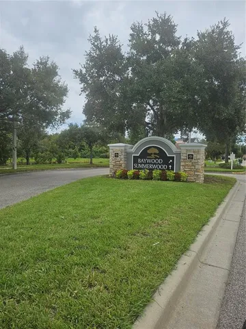a view of a yard in front of a house