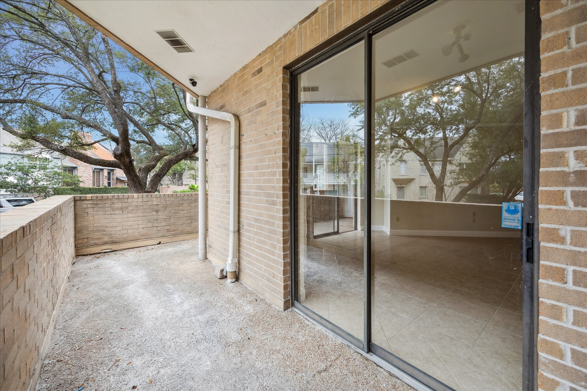 5220 Weslayan Street, Unit 109 Houston, TX 77005 - Photo 19 of 21 View of the large patio under the trees.