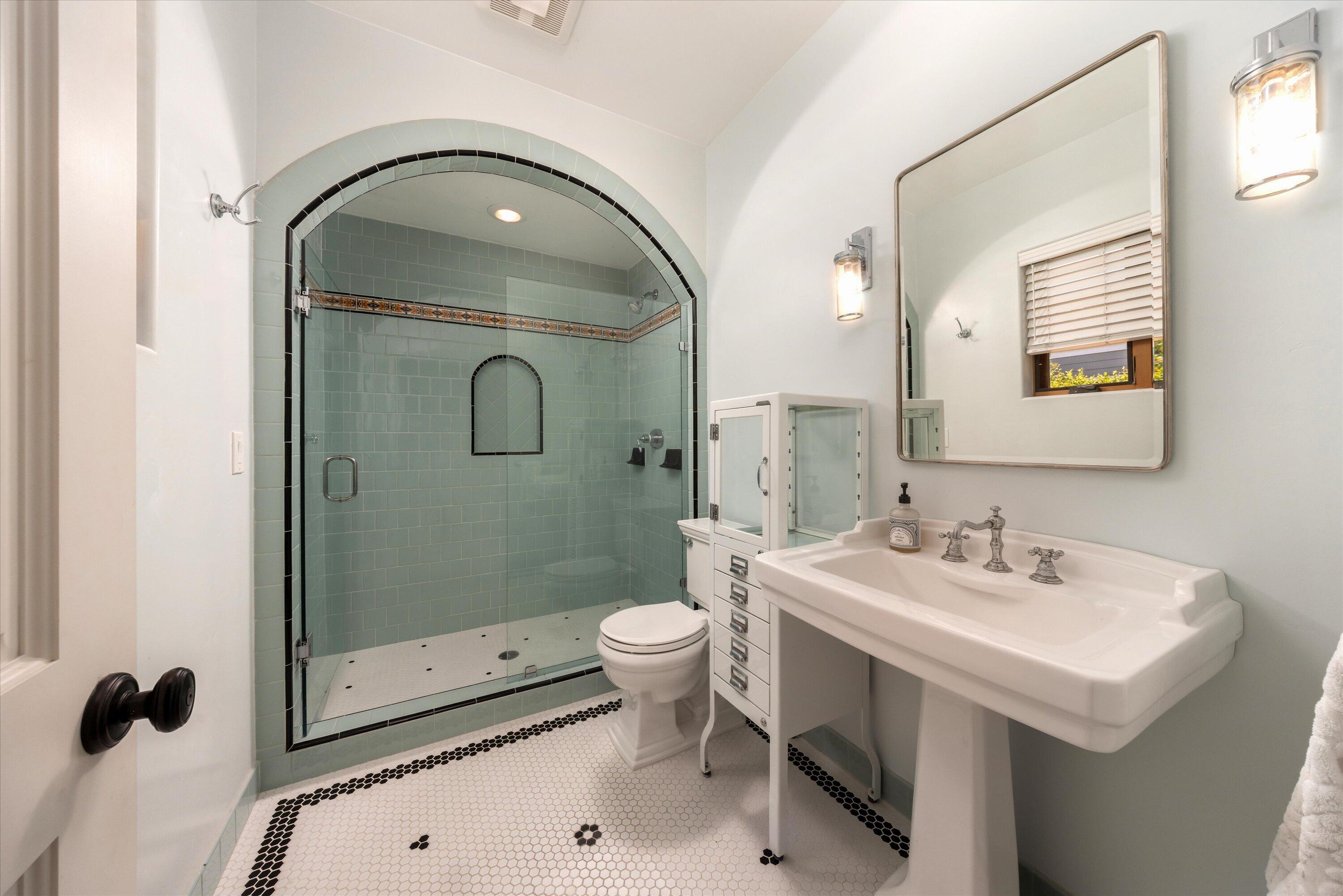 333 Conejo Road Santa Barbara, CA 93103 - Photo 25 of 43 a bathroom with a sink a toilet and shower