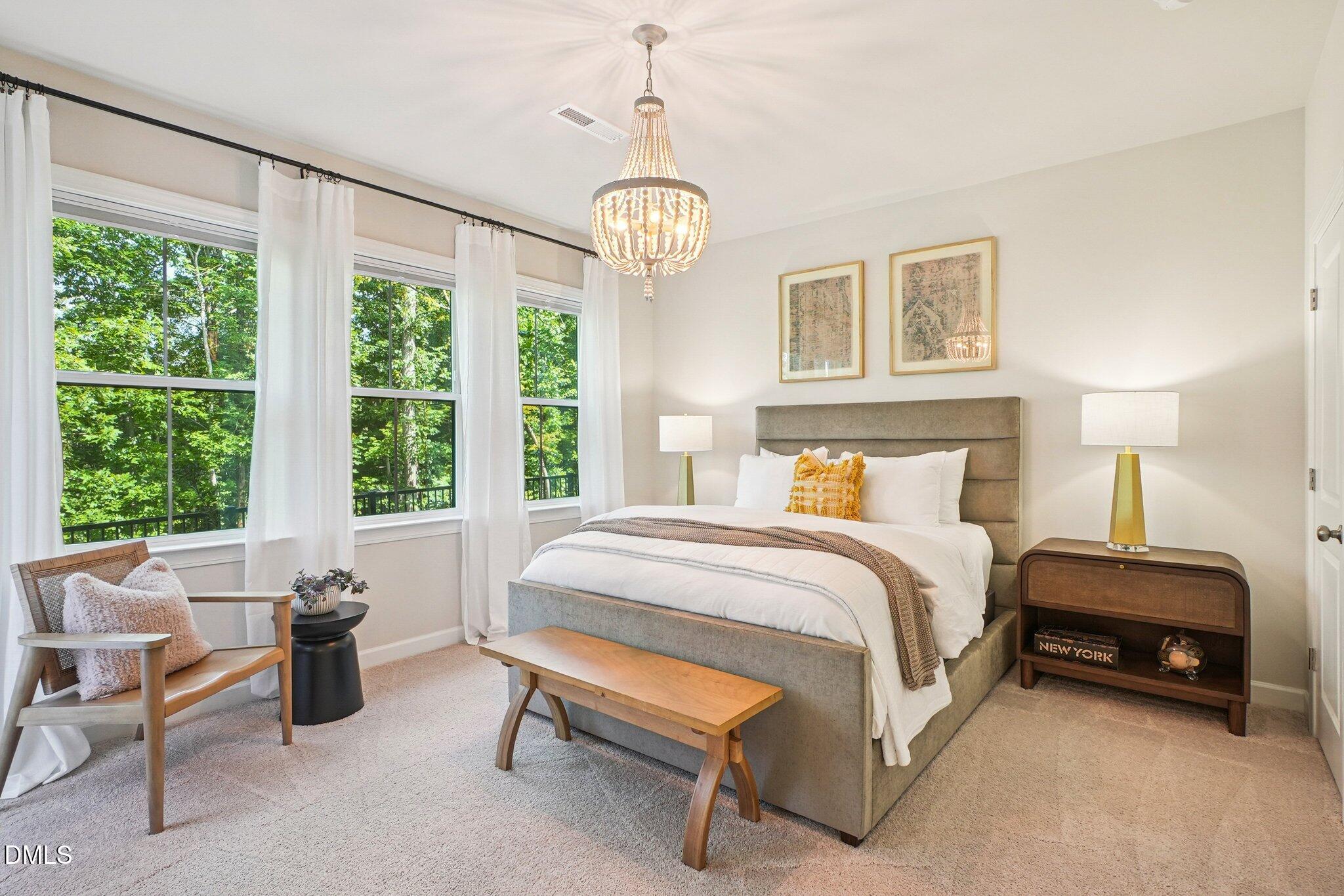 4822 Cypress Tree Lane Raleigh, NC 27612 - Photo 13 of 28 a spacious bedroom with a bed and a large window