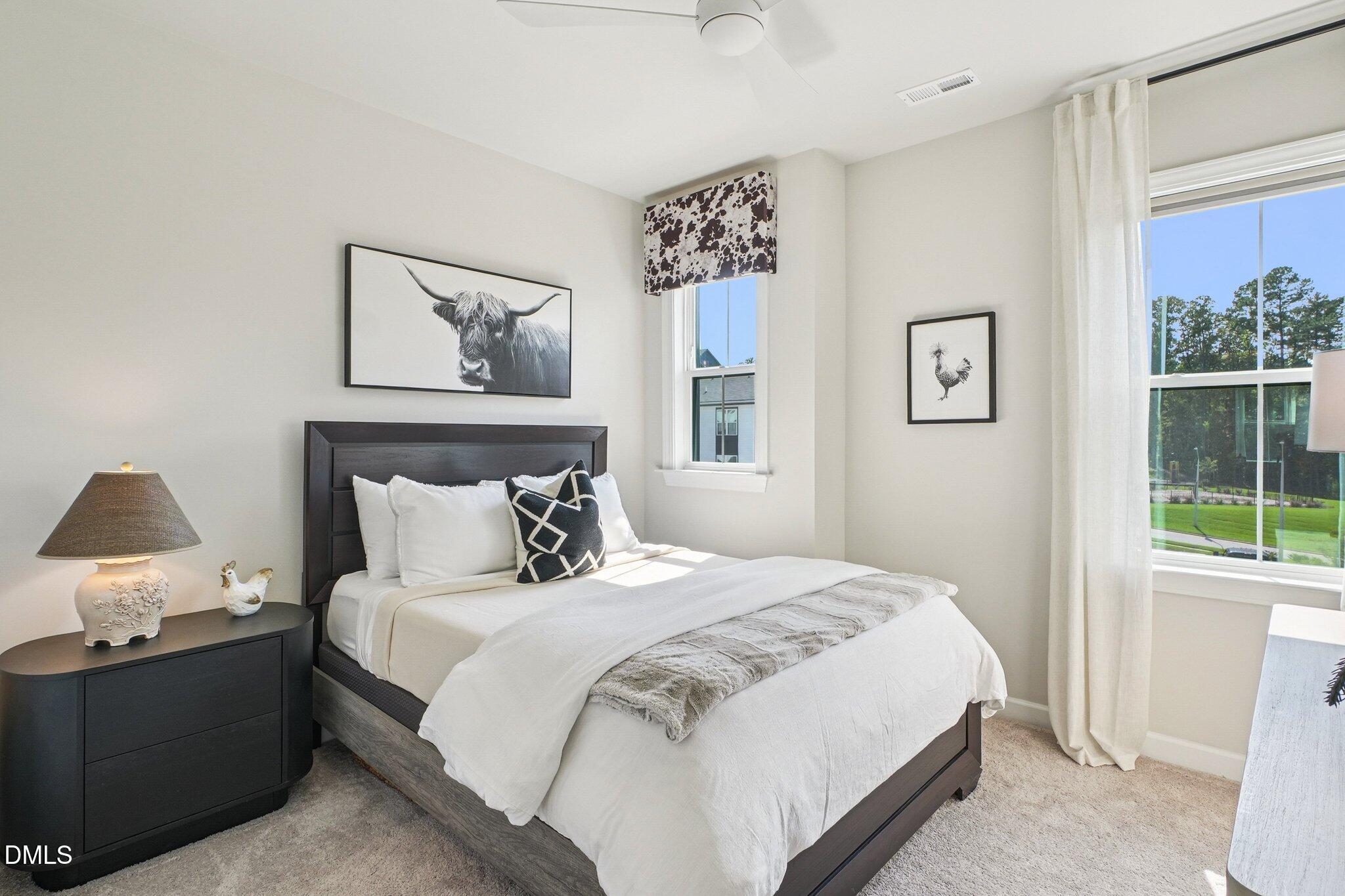 4822 Cypress Tree Lane Raleigh, NC 27612 - Photo 15 of 28 a bedroom with a bed and a window