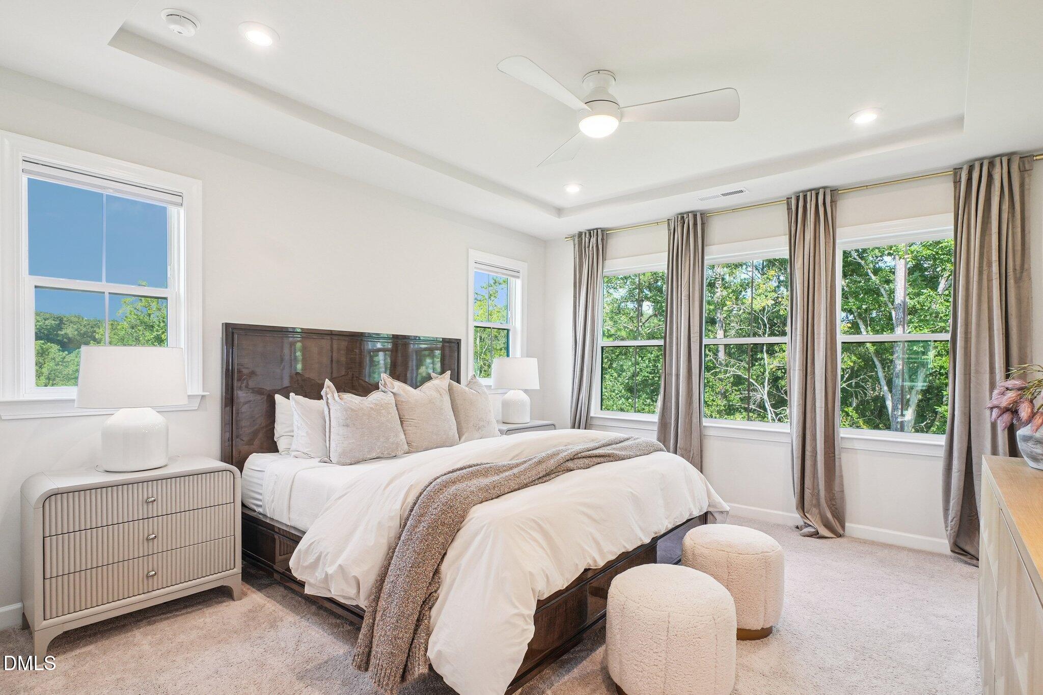 4822 Cypress Tree Lane Raleigh, NC 27612 - Photo 17 of 28 a bedroom with bed and a large window