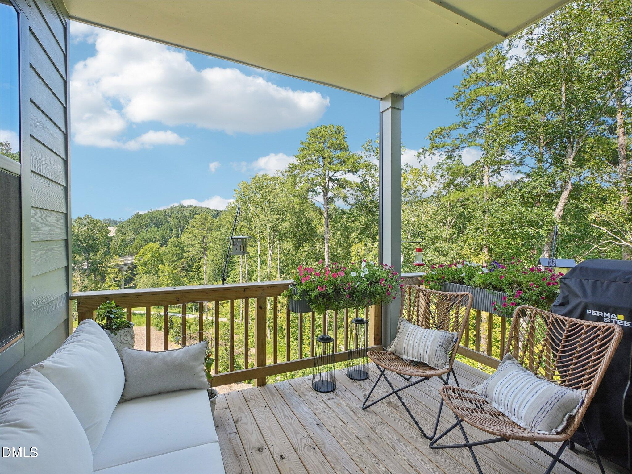 4822 Cypress Tree Lane Raleigh, NC 27612 - Photo 20 of 28 a balcony with furniture and wooden floor