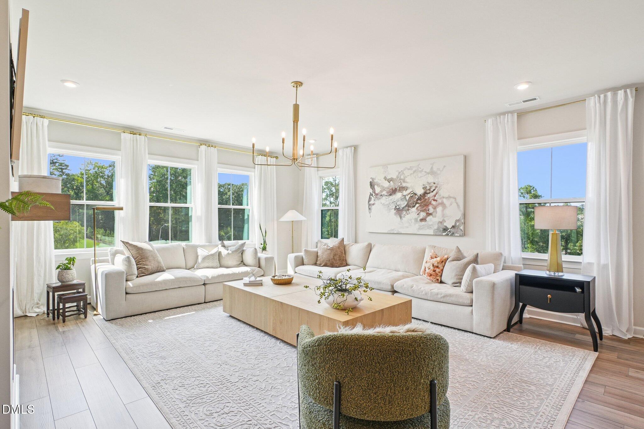4822 Cypress Tree Lane Raleigh, NC 27612 - Photo 5 of 28 a living room with furniture and a large window