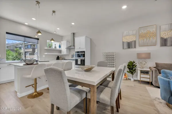 a kitchen with a table and chairs in it
