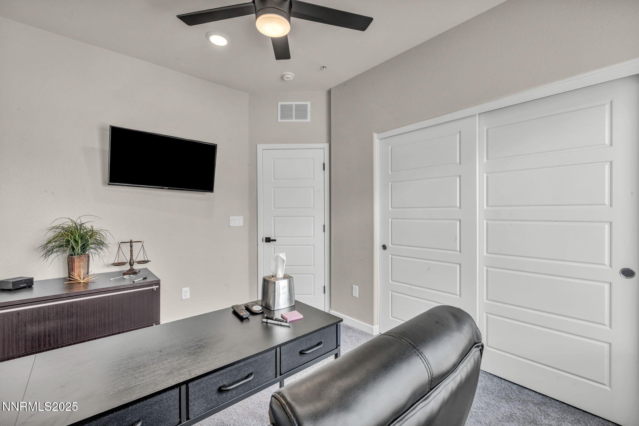 150 Rissone Lane Reno, NV 89503 - Photo 22 of 53 a living room with furniture and a flat screen tv