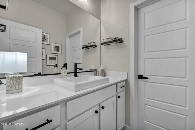 a view of a sink and mirror