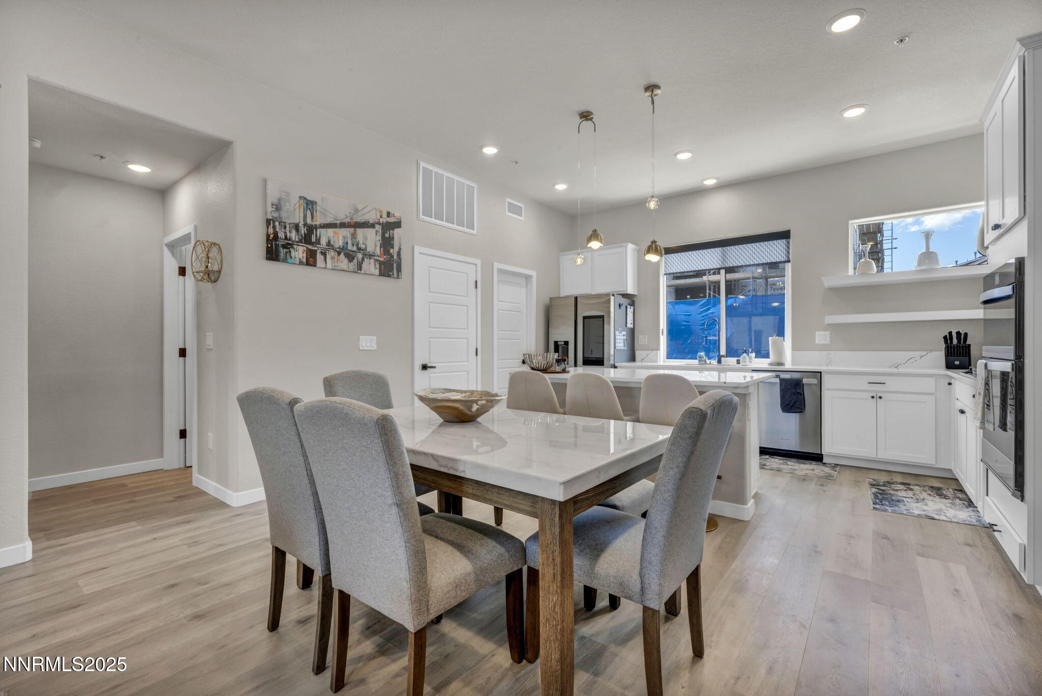150 Rissone Lane Reno, NV 89503 - Photo 4 of 53 a view of a dining room with furniture and wooden floor