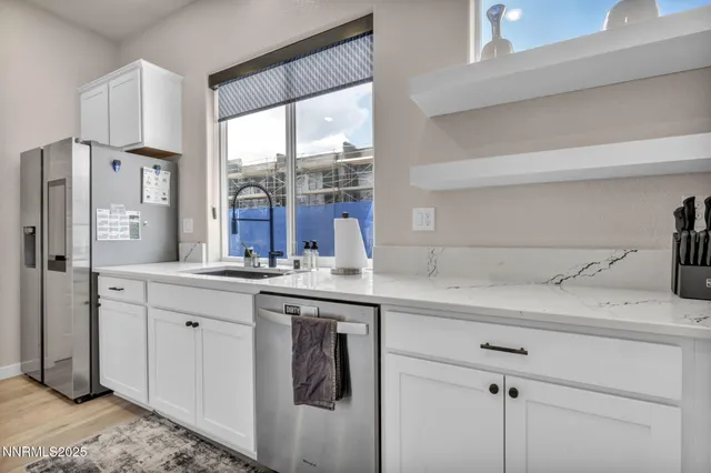 a kitchen with a sink stove and refrigerator