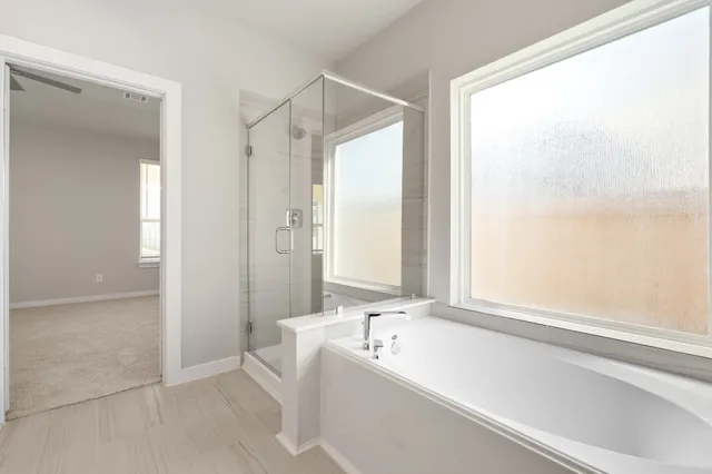 a bathroom with double sink and a mirror