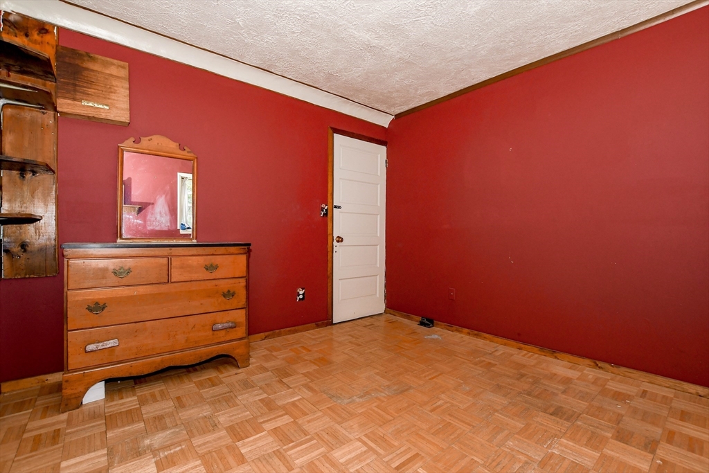 6 Gilbert Way Wareham, MA 02571 - Photo 34 of 41 a room with a dresser and a mirror