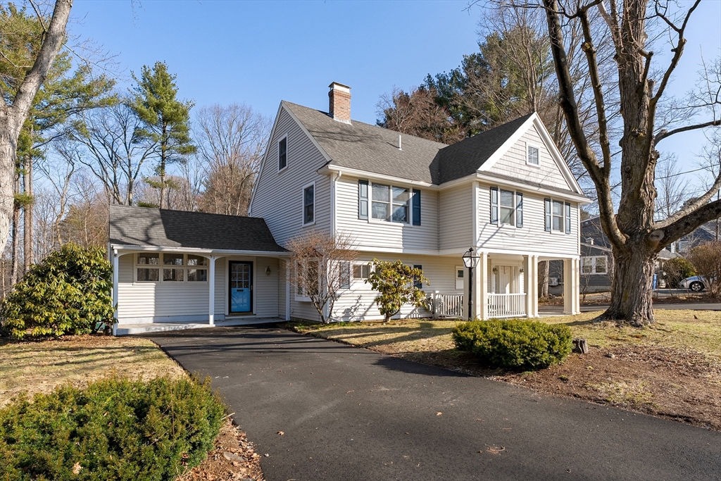 51 Winslow Road Reading, MA 01867 - Photo 1 of 40 front view of a house with a yard